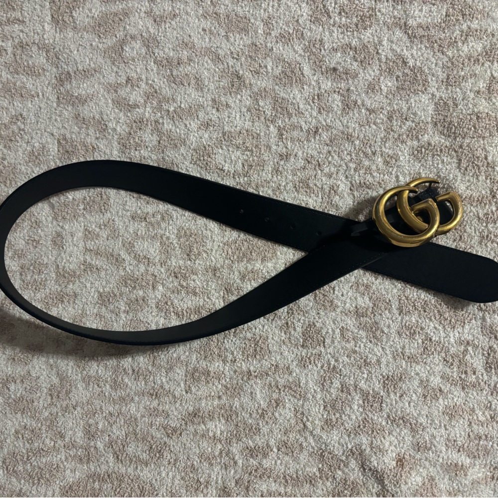 Black and gold Gucci belt